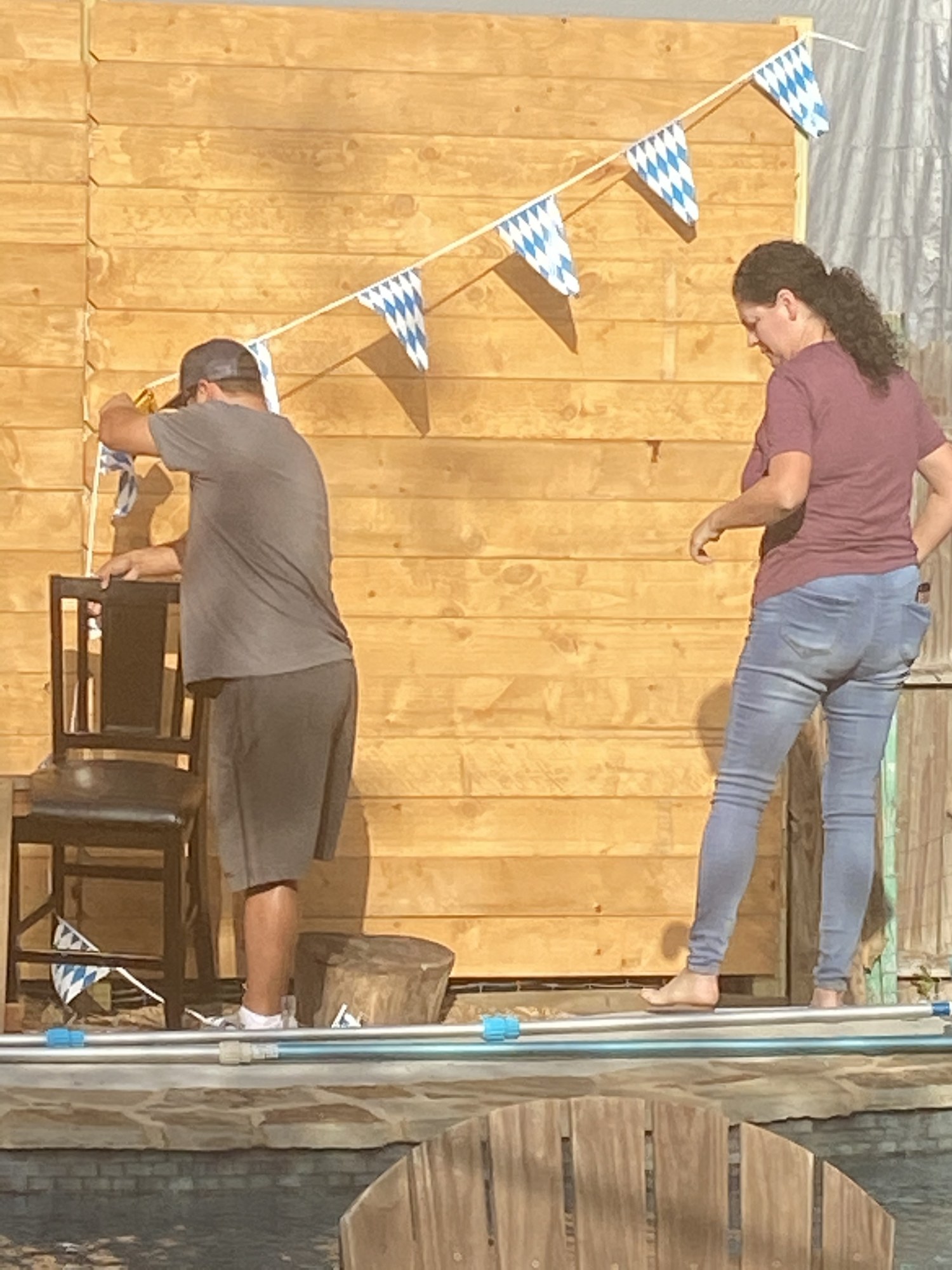 Friends decorating the festival area with Bavarian bunting